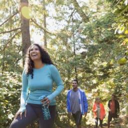 A group of four happy people on a hike together