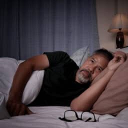 Man lying awake at night