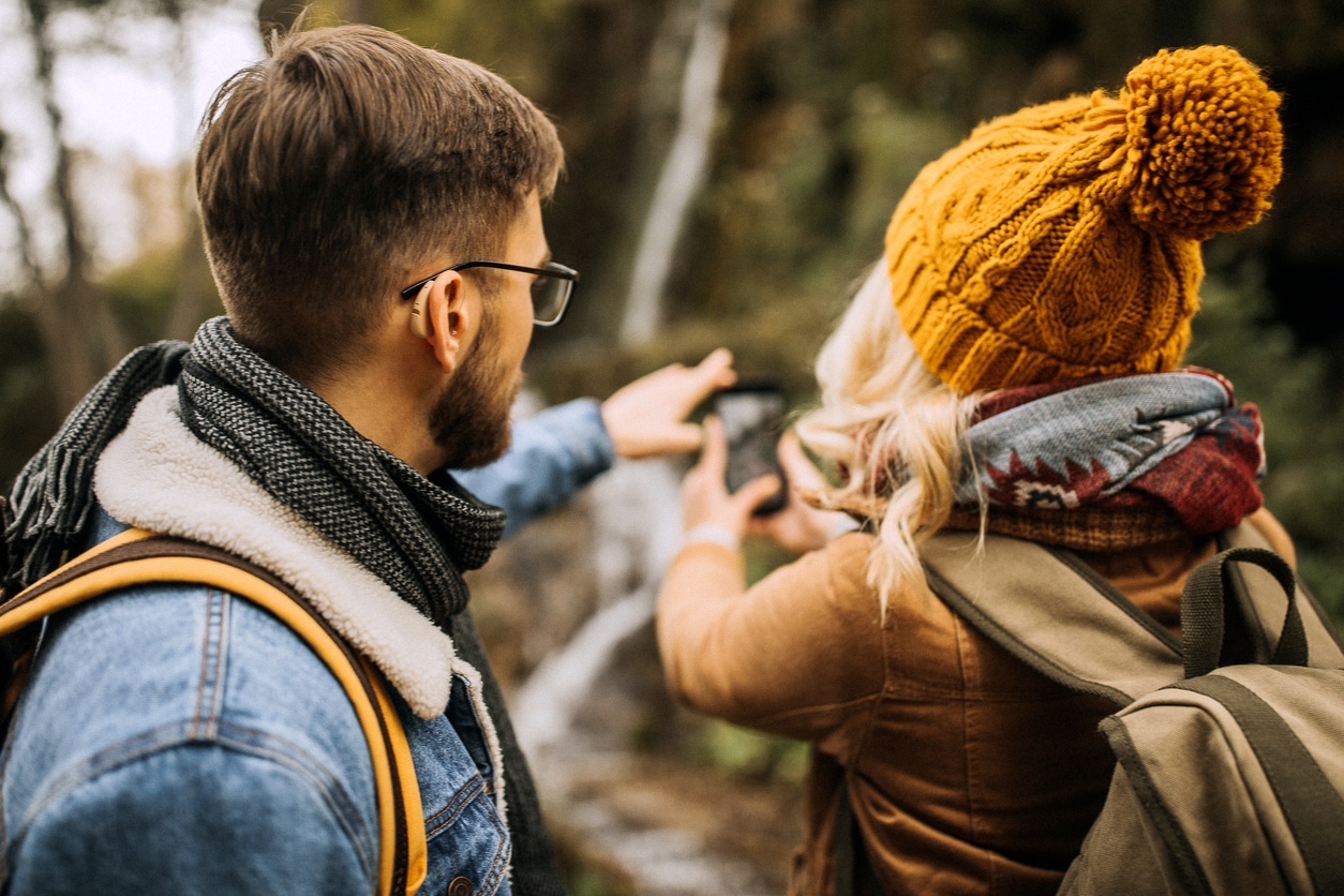 Man hikes with hearing aids
