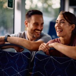 Happy friends on a city bus